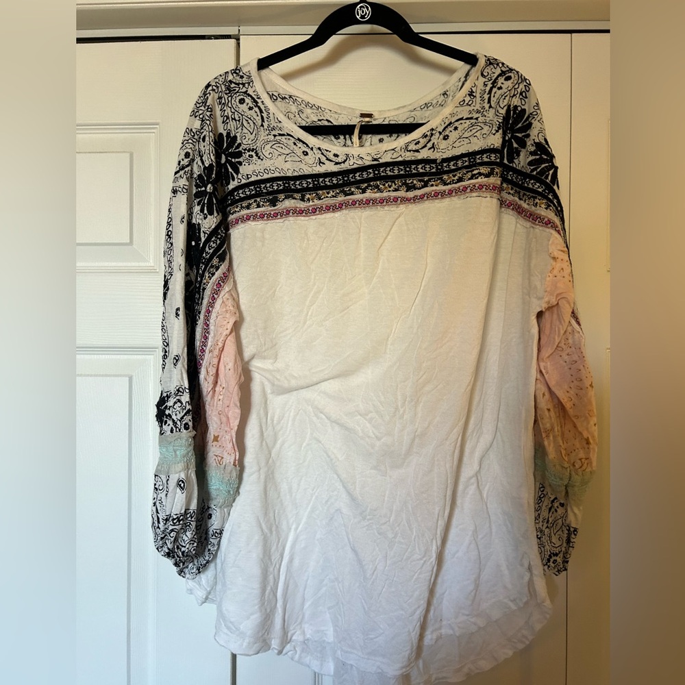 Free people size large. White knit with detailed sleeves and top